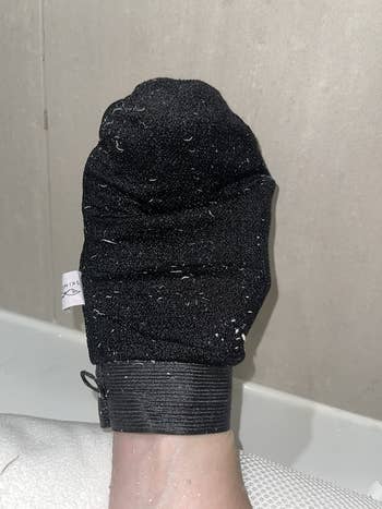 reviewer's mitt covered in skin