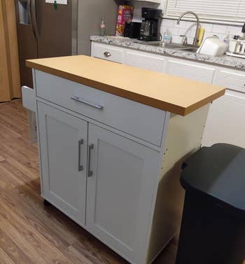 before of portable island kitchen with wooden coutertop