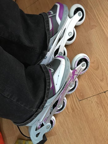 Reviewer wearing purple and white skates