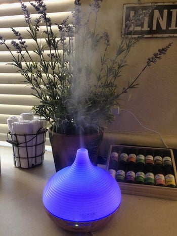 the same diffuser glowing a purple color