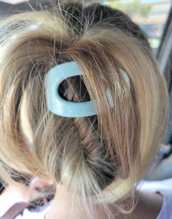 Hair secured successful  a stylish updo with a large, sleek hairsbreadth  clip portion    successful  a car   setting