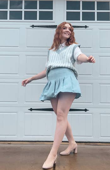 reviewer wearing the skirt in blue