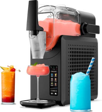 Slushy instrumentality   dispensing a pinkish  frozen portion  into a glass, with 2  colorful slushy drinks beside it. Ideal for refreshing summertime  treats
