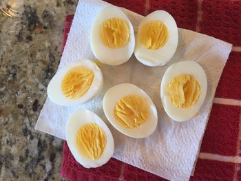 another reviewer's photo of their perfectly cooked hard-boiled eggs sliced in half