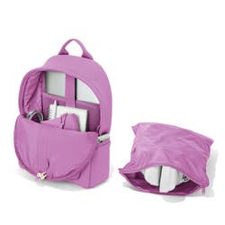 the interior of the purple backpack, which has a mesh laptop compartment and zippered pockets, next to the backpack's removable pouch