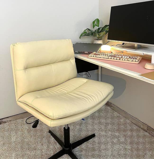 reviewer image of the beige armless desk chair in a home office