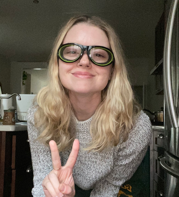 BuzzFeed writer wearing the black and green onion goggles