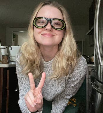 BuzzFeed writer wearing the black and green onion goggles