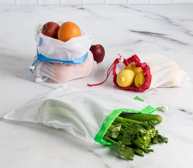 mesh produce bags holding various fruits and veggies