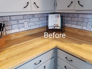 a reviewer's before picture showing a kitchen without lights