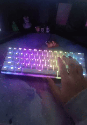 gif of reviewer typing on a backlit keyboard
