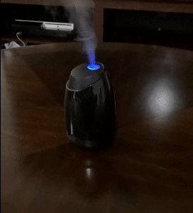 reviewer gif of the diffuser lit up and misting
