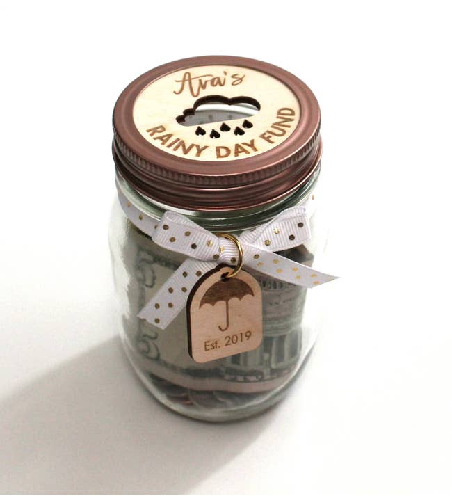 A clear jar with a lid personalized for 