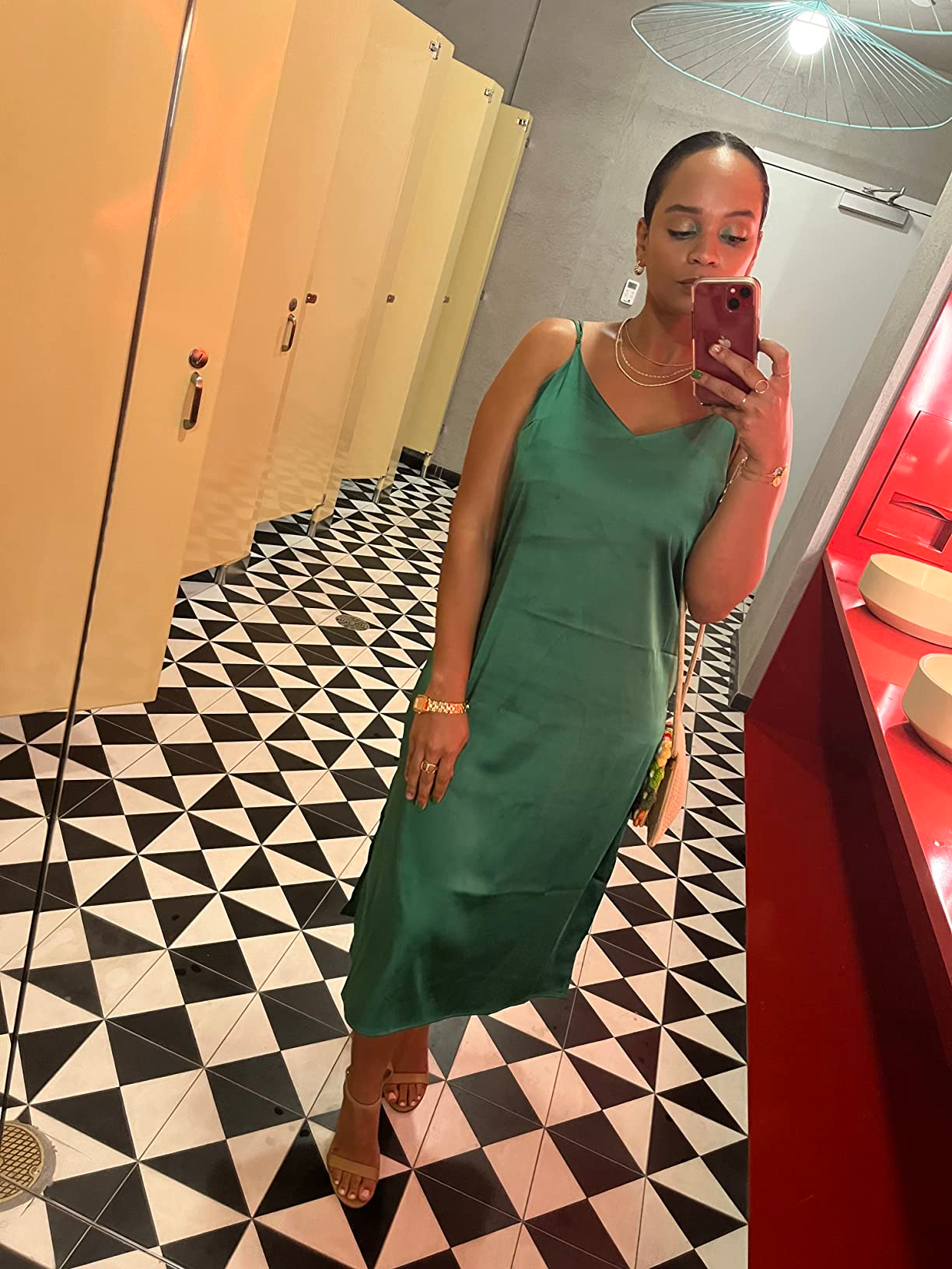 a reviewer wearing the green dress