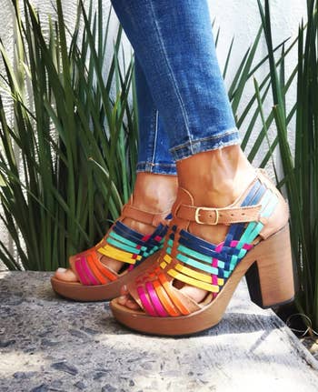 model wearing the multicolored platform sandals