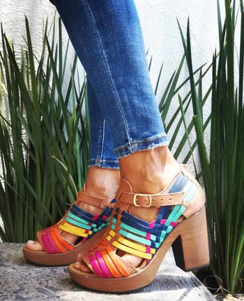 model wearing the multicolored platform sandals