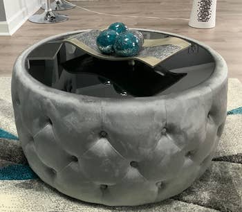Reviewer image of the gray ottoman coffee table