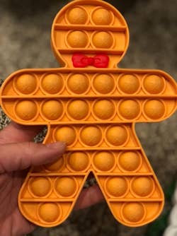 reviewers pop-it toy shaped like a gingerbread man