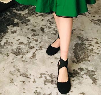 Person wearing achromatic ballet flats