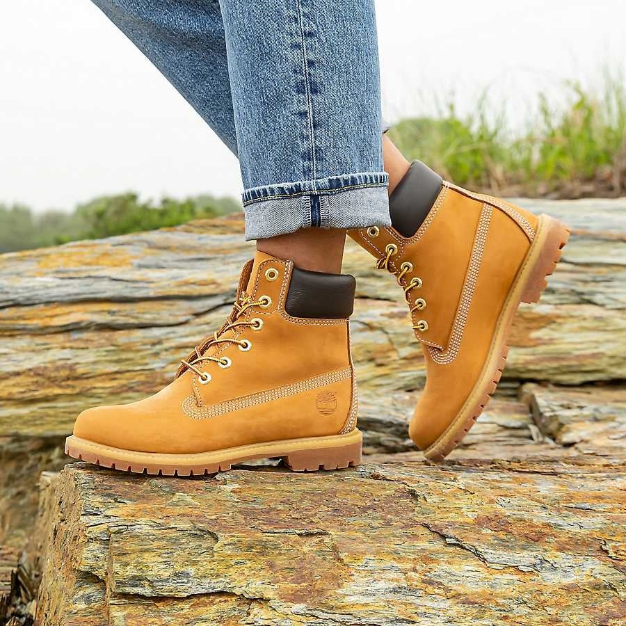 a model wearing the boots in the yellow color