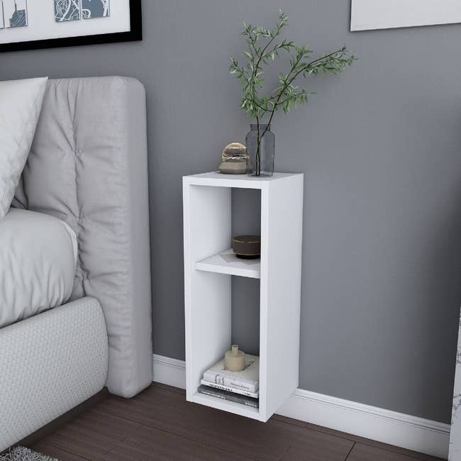 white floating nightstand with open design and two shelves