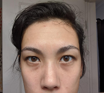 a reviewer photo before applying the concealer 