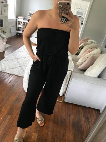Image of reviewer wearing black strapless jumpsuit