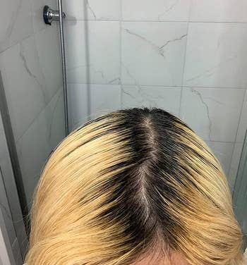 reviewer before photo showing their dark roots against their blonde hair