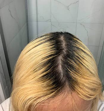 reviewer before photo showing their dark roots against their blonde hair