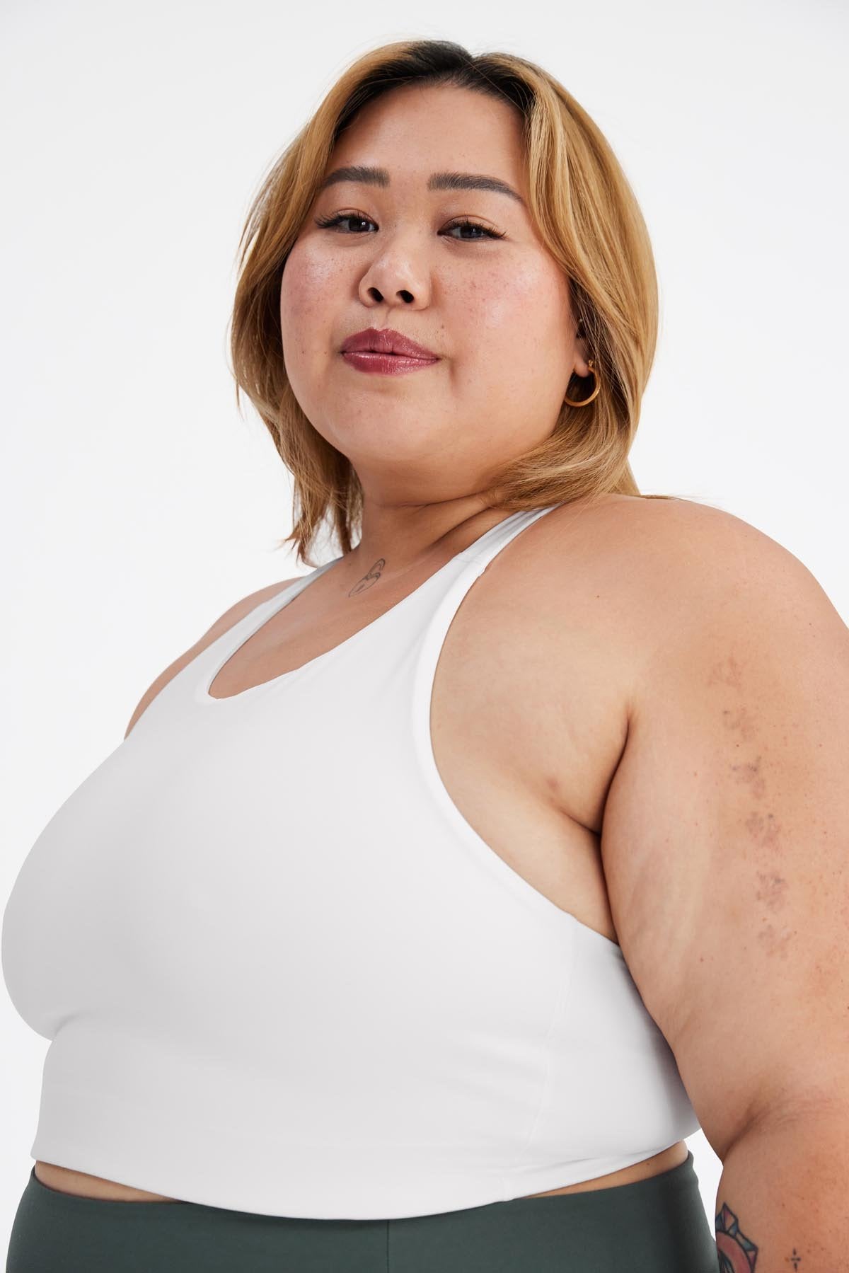 model wearing white sports bra