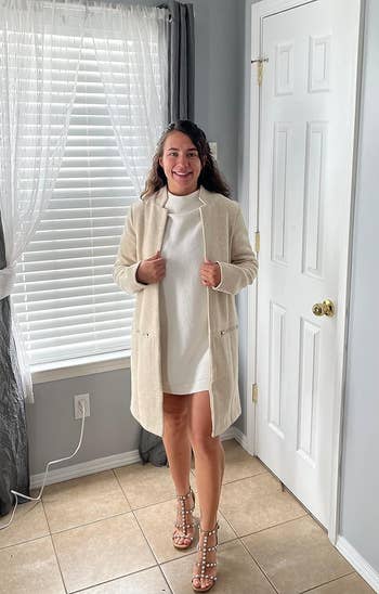 reviewer wearing the coat in cream