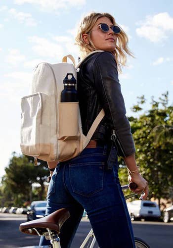 model wearing the backpack successful  beige