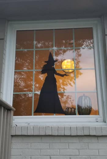 the vinyl witch sticker in a reviewer's window