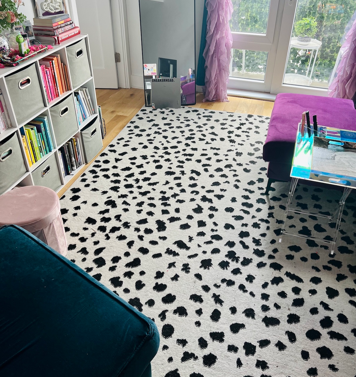 buzzfeed editor's living room with the black white spotted rug in it