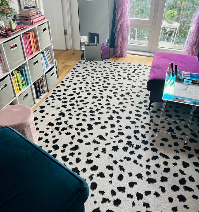 buzzfeed editor's living room with the black white spotted rug in it 