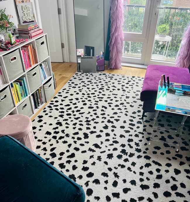 buzzfeed editor's living room with the black white spotted rug in it 