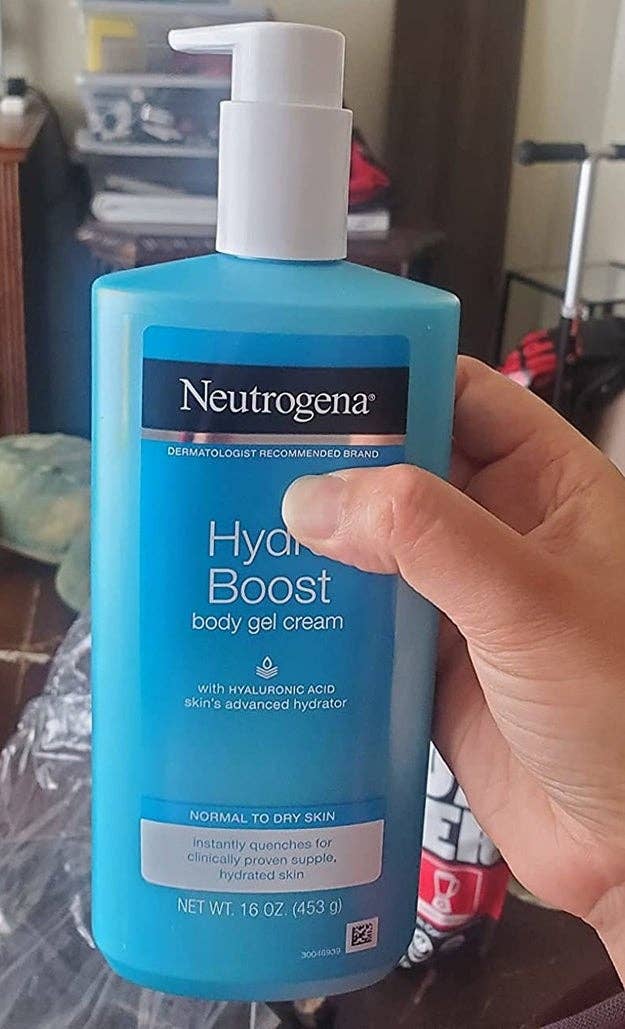 Person holding a vessel  of Neutrogena Hydro Boost assemblage  gel cream, labeled for mean   to adust  tegument  with hyaluronic acerb  for hydration