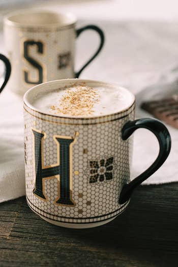 a close up of the H mug with coffee in it