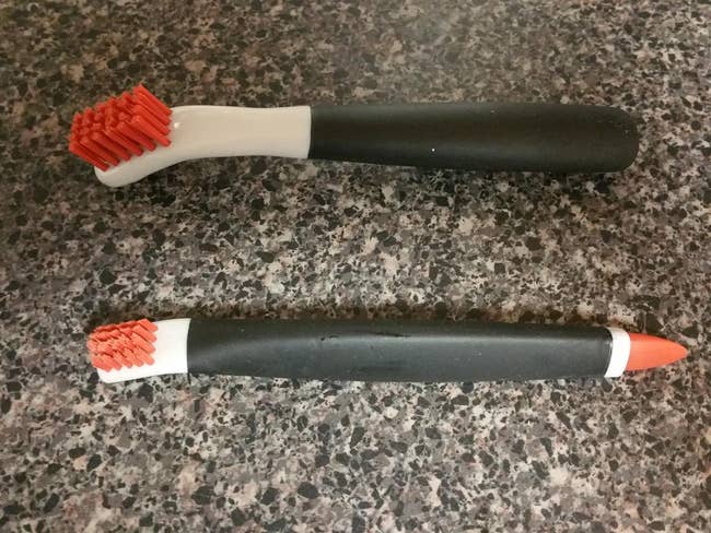 Reviewer image of two red, white, and black brushes on top of counter