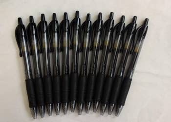 reviewer photo of numerous pilot g2 pens next to each other