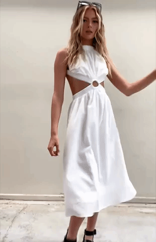 GIF of model turning around to show backless dress