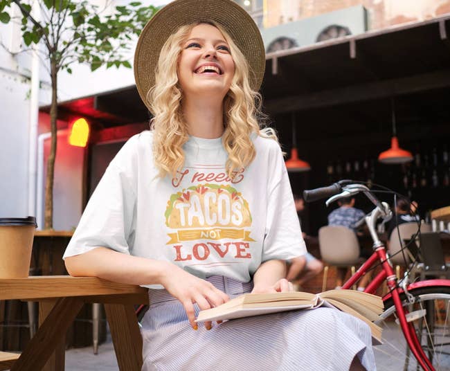 model wearing the I need tacos not love tee in white