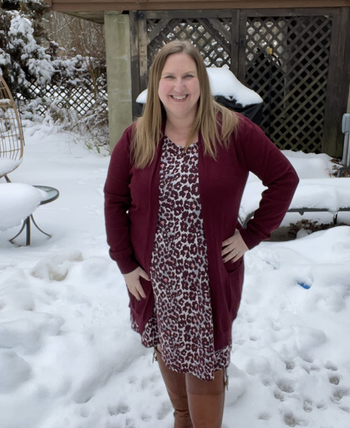 reviewer wearing a berry colored version