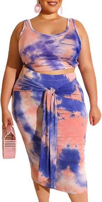 Person wearing a stylish tie-dye tank top and skirt set, holding a pink bag, suitable for casual outings
