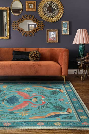 living room with flamingo print area rug