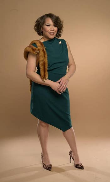 Image of reviewer wearing green dress