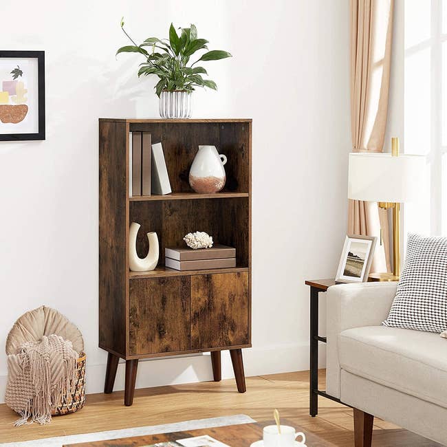 the dark wood bookcase unit in a living room
