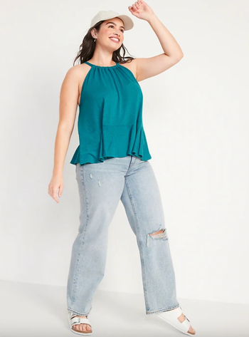 model wearing turquoise white swing halter top