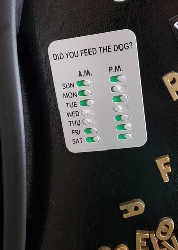 reviewer photo showing the dog food tracker on their fridge