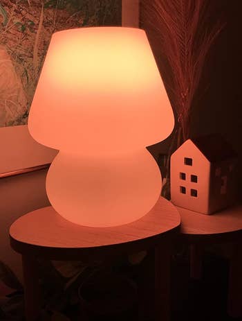 the mushroom lamp glowing an orange-y color
